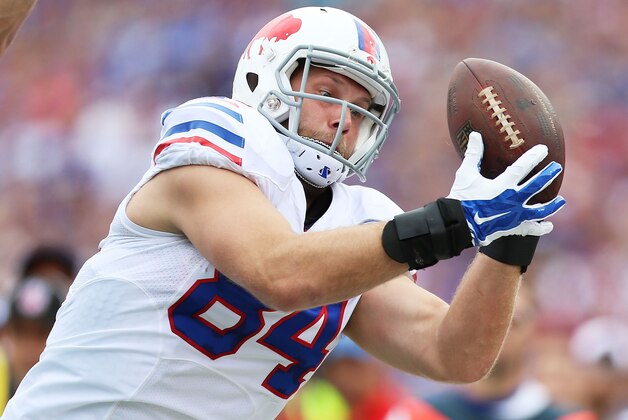 ORCHARD PARK, NY - SEPTEMBER 14:   Scott Chandler #84 of the Buffalo Bills makes a reception against the Miami Dolphins during the first half at Ralph Wilson Stadium on September 14, 2014 in Orchard Park, New York.  (Photo by Vaughn Ridley/Getty Images)
