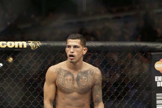 Anthony Pettis runs on the ring before fighting with Donald Cerrone during UFC Lightweight Championship on FOX 6 at the United Center in Chicago, Saturday, Jan. 26, 2013. Pettis won the bout. (AP Photo/Nam Y. Huh)