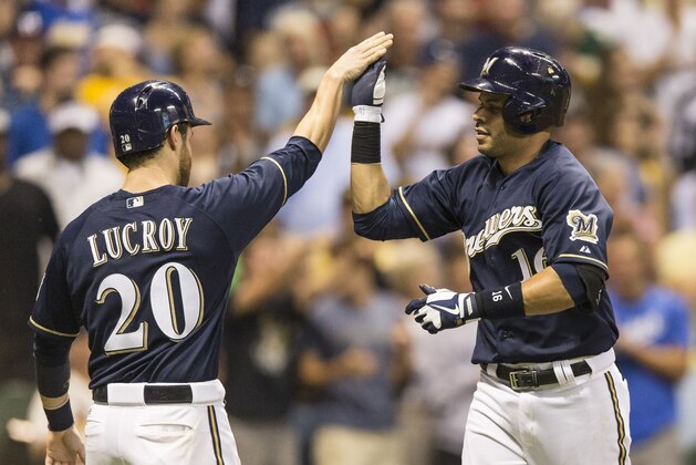 MILWAUKEE, WI - AUGUST 19: Aramis Ramirez #16 of the Milwaukee Brewers gets a high five from teammate Jonathan Lucroy #20 after he hit a two run home run off of Michael Wacha #52 of the St Louis Cardinals in the seventh inning at Miller Park on August 19, 2013 in Milwaukee, Wisconsin.  (Photo by Tom Lynn/Getty Images)