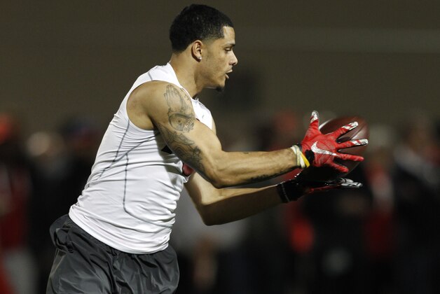 Wide receiver Devin Smith catches a pass during a drill at NFL Pro Day at Ohio State University in Columbus, Ohio,  Friday, March 13, 2015. (AP Photo/Paul Vernon)