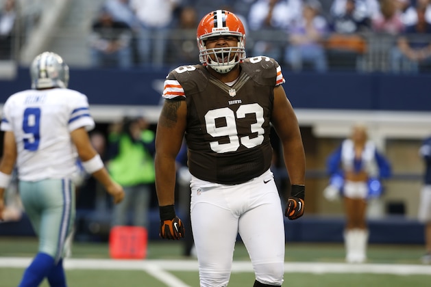 Cleveland Browns' John Hughes (93) celebrates sacking Dallas Cowboys' Tony Romo (9) in the first half of an NFL football game Sunday, Nov. 18, 2012 in Arlington, Texas. (AP Photo/Sharon Ellman)