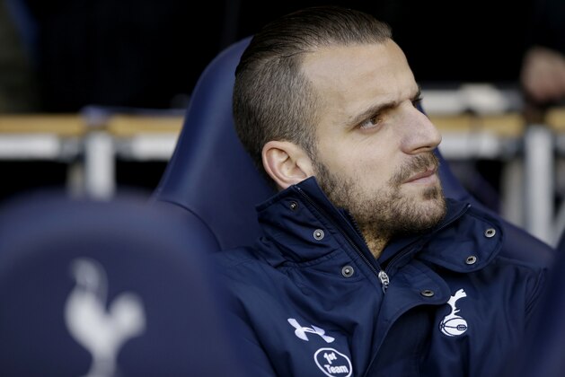 Tottenham Hotspur substitute Roberto Soldado sits on the sideline before the start of the English Premier League soccer match between Tottenham Hotspur and Burnley at White Hart Lane stadium in London, Saturday, Dec. 20, 2014.  (AP Photo/Matt Dunham)