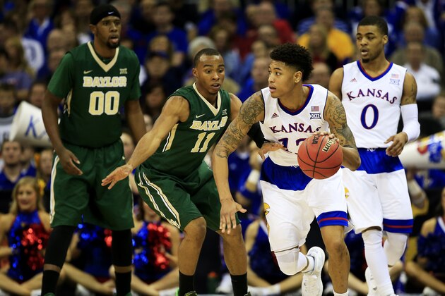 KANSAS CITY, MO - MARCH 13:  Kelly Oubre Jr. #12 of the Kansas Jayhawks controls the ball against Lester Medford #11 of the Baylor Bears in the second half during a semifinal game of the 2015 Big 12 Basketball Tournament at Sprint Center on March 13, 2015 in Kansas City, Missouri.  (Photo by Jamie Squire/Getty Images)
