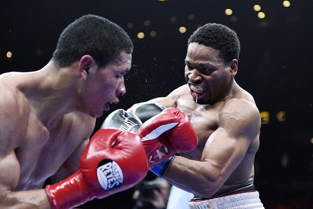 ONTARIO, CA - MARCH 13:  Shawn Porter (R) lands a punch against Erick Bone during their 12 round welterweight bout at Citizens Business Bank Arena March 13, 2015 in Ontario, California. Porter won by knockout in the fifth round. (Photo by Kevork Djansezian/Getty Images)