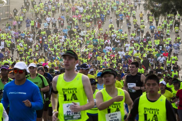 Los Angeles students run the 28th Asics L.A. Marathon in Los Angeles Sunday, March 17, 2013. The 26.2-mile event begins at Dodger Stadium and ends in Santa Monica, Calif. (AP Photo/Damian Dovarganes)