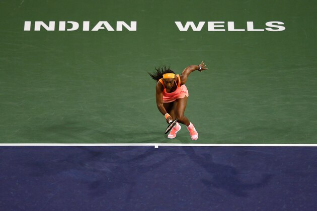 INDIAN WELLS, CA - MARCH 13:  Serena Williams of USA in action against Monica Niculescu of Romania during day five of the BNP Paribas Open tennis at the Indian Wells Tennis Garden on March 13, 2015 in Indian Wells, California.  (Photo by Julian Finney/Getty Images)