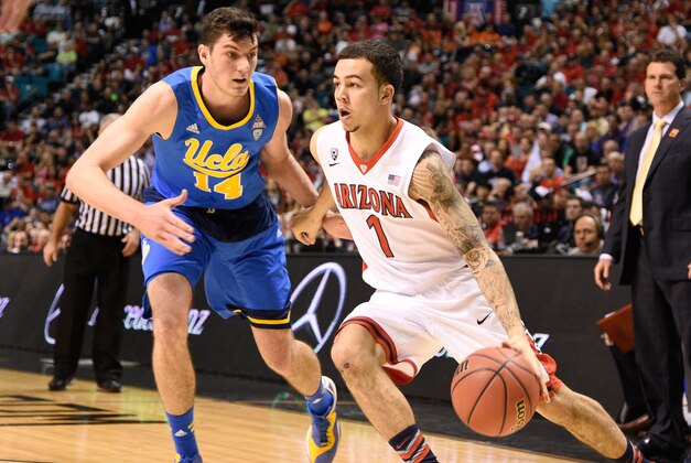 March 13, 2015; Las Vegas, NV, USA; Arizona Wildcats guard Gabe York (1) dribbles the basketball against UCLA Bruins forward Gyorgy Goloman (14) during the first half in the semifinal round of the Pac-12 Conference tournament at MGM Grand Garden Arena. Mandatory Credit: Kyle Terada-USA TODAY Sports