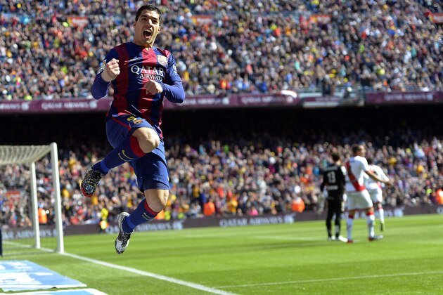 FILE - In this March 8, 2015 file photo FC Barcelona's Luis Suarez, from Uruguay, reacts after scoring against Rayo Vallecano during a Spanish La Liga soccer match at the Camp Nou stadium in Barcelona, Spain. (AP Photo/Manu Fernandez, file)