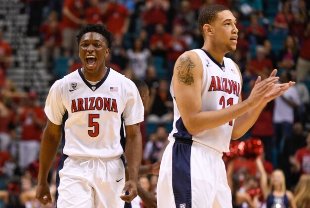 March 12, 2015; Las Vegas, NV, USA; Arizona Wildcats forward Stanley Johnson (5) and forward Brandon Ashley (21) celebrate against the California Golden Bears during the second half in the quarterfinal round of the Pac-12 Conference tournament at MGM Grand Garden Arena. The Wildcats defeated the Golden Bears 73-51. Mandatory Credit: Kyle Terada-USA TODAY Sports