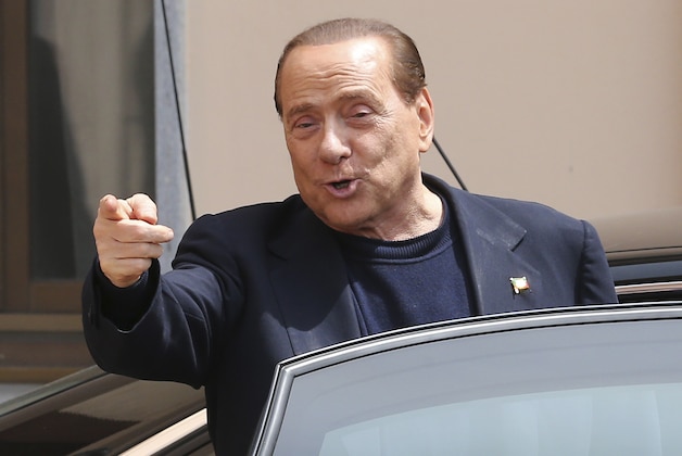 FILE - In this Friday, May 9, 2014 file photo, Silvio Berlusconi smiles as he leaves the