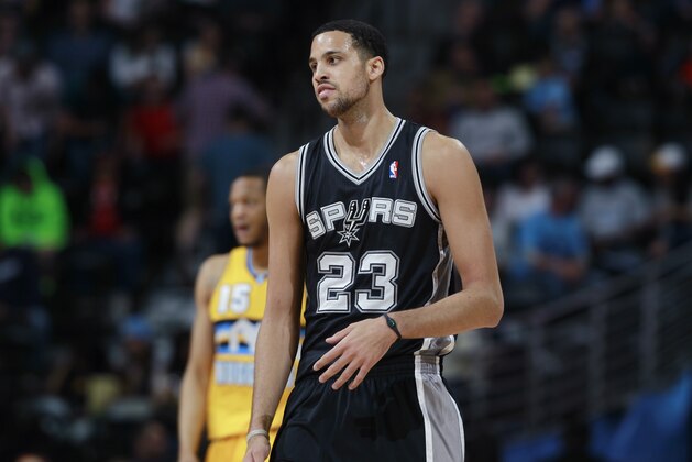 San Antonio Spurs forward Austin Daye takes court to face the Denver Nuggets in the fourth quarter of the Spurs' 133-102 victory in an NBA basketball game in Denver on Friday, March 28, 2014. (AP Photo/David Zalubowski)