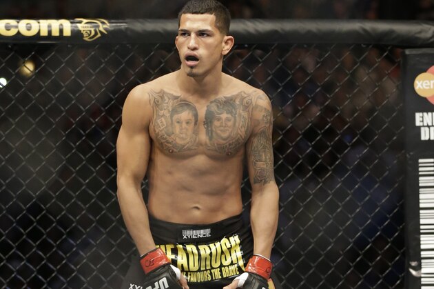 Anthony Pettis runs on the ring before fighting with Donald Cerrone during UFC Lightweight Championship on FOX 6 at the United Center in Chicago, Saturday, Jan. 26, 2013. Pettis won the bout. (AP Photo/Nam Y. Huh)
