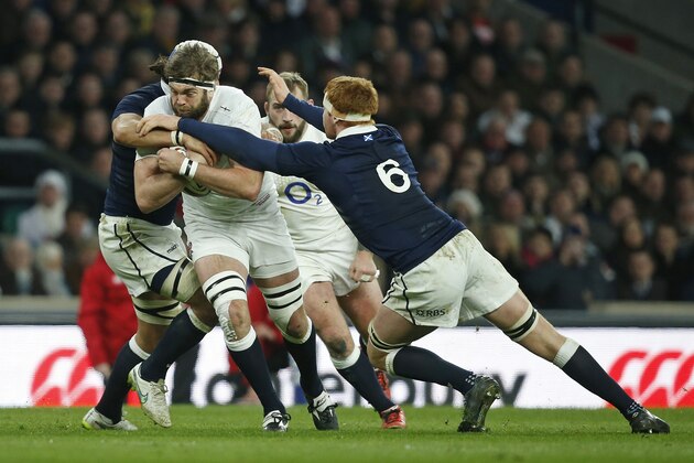 England’s Geoff Parling is tackled  during the Six Nations rugby union match between England and Scotland at Twickenham stadium in London, Saturday, March, 14, 2015. (AP Photo/Alastair Grant)