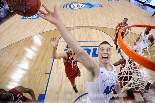 GREENSBORO, NC - MARCH 12:  Marshall Plumlee #40 of the Duke Blue Devils skies for a rebound against the North Carolina State Wolfpack during the quarterfinals of the ACC Basketball Tournament at Greensboro Coliseum on March 12, 2015 in Greensboro, North Carolina.  (Photo by Grant Halverson/Getty Images)