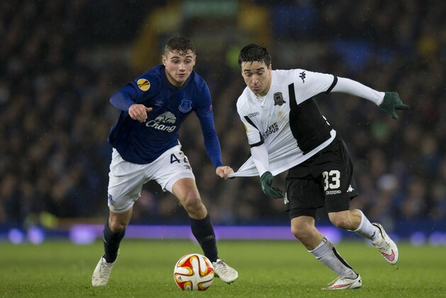 Everton's Ryan Ledson, left, fights for the ball against FC Krasnodar's Mauricio Pereyra during the Europa League Group H soccer match between Everton and FC Krasnodar at Goodison Park Stadium, Liverpool, England, Thursday Dec. 11, 2014. (AP Photo/Jon Super)
