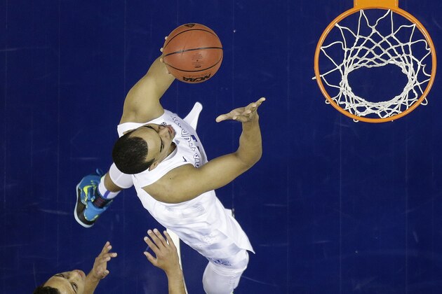 Kentucky forward Trey Lyles (41) shoots against Auburn guard Devin Waddell (31) during the first half of an NCAA college basketball game in the semifinal round of the Southeastern Conference tournament, Saturday, March 14, 2015, in Nashville, Tenn. (AP Photo/Steve Helber)