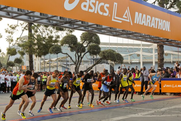 Men's elite runners start the 28th Asics L.A. Marathon in Los Angeles Sunday, March 17, 2013. The 26.2-mile event begins at Dodger Stadium and ends in Santa Monica, Calif. (AP Photo/Damian Dovarganes)