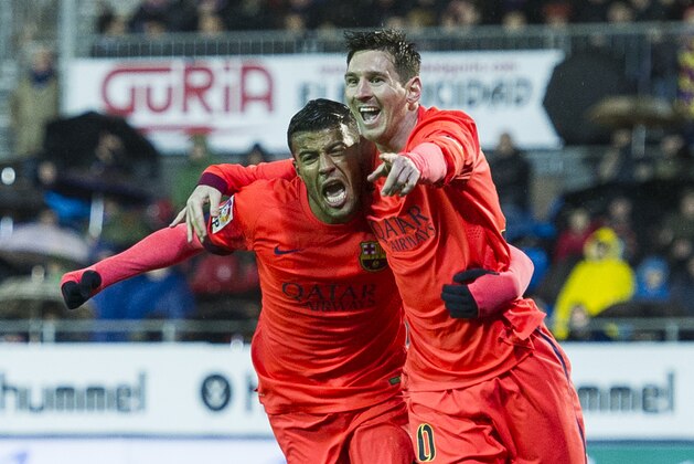 EIBAR, SPAIN - MARCH 14:  Lionel Messi of FC Barcelona celebrates with his teammate Rafinha of FC Barcelona after scoring his goal during the La Liga match between SD Eibar and FC Barcelona at Ipurua Municipal Stadium on March 14, 2015 in Eibar, Spain.  (Photo by Juan Manuel Serrano Arce/Getty Images)