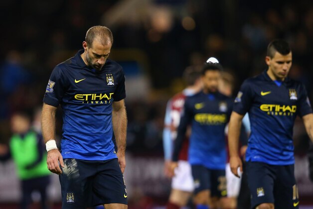 BURNLEY, ENGLAND - MARCH 14:  A dejected Pablo Zabaleta and Sergio Aguero of Manchester City after the Barclays Premier League match between Burnley and Manchester City at Turf Moor on March 14, 2015 in Burnley, England.  (Photo by Alex Livesey/Getty Images)