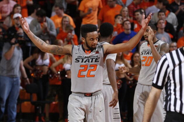 STILLWATER, OK - FEBRUARY 7: Jeff Newberry #22 of the Oklahoma State Cowboys celebrates in the second half of the game against the Kansas Jayhawks at Gallagher-Iba Arena on February 7, 2015 in Stillwater, Oklahoma. Oklahoma State defeated Kansas 67-62. (Photo by Joe Robbins/Getty Images)