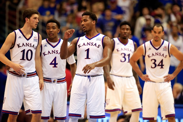 LAWRENCE, KS - DECEMBER 05:  Wayne Seldin, Jr. # 1 of the Kansas Jayhawks leads Devonte Graham #4 ,Perry Ellis #34, Jamari Traylor #31, and Sviatoslav Mykhailiuk #10 onto the court after a timeout in the game against the Florida Gators at Allen Fieldhouse on December 5, 2014 in Lawrence, Kansas.  (Photo by Jamie Squire/Getty Images)