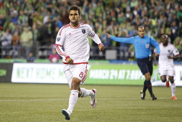 Mar 14, 2015; Seattle, WA, USA; San Jose Earthquakes forward Chris Wondolowski (8) runs to the corner to celebrate his first goal during the first half of a game against the Seattle Sounders FC at CenturyLink Field. San Jose won 3-2. Mandatory Credit: Jennifer Buchanan-USA TODAY Sports