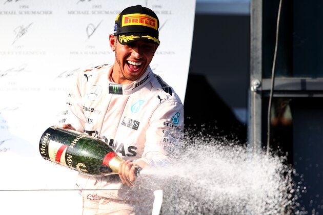 MELBOURNE, AUSTRALIA - MARCH 15:  Lewis Hamilton of Great Britain and Mercedes GP celebrates on the podium after winning the Australian Formula One Grand Prix at Albert Park on March 15, 2015 in Melbourne, Australia.  (Photo by Mark Thompson/Getty Images)