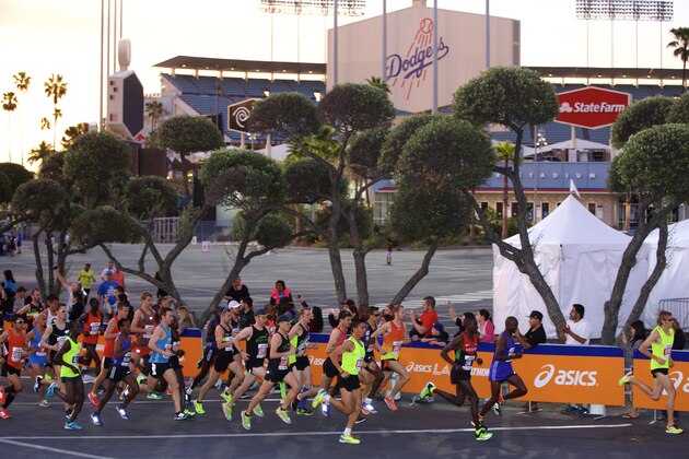 Men's elite runners start the 30th Los Angeles Marathon Sunday, March 15, 2015. The 26.2-mile event begins at Dodger Stadium and ends in Santa Monica, Calif. (AP Photo/Damian Dovarganes)