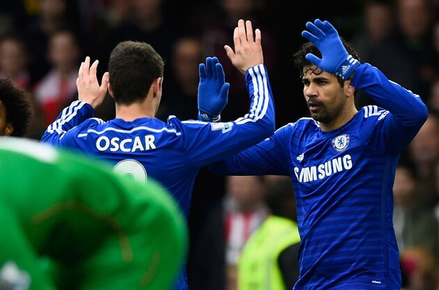 LONDON, ENGLAND - MARCH 15:  Diego Costa of Chelsea celebrates scoring the opening goal with Oscar of Chelsea during the Barclays Premier League match between Chelsea and Southampton at Stamford Bridge on March 15, 2015 in London, England.  (Photo by Mike Hewitt/Getty Images)