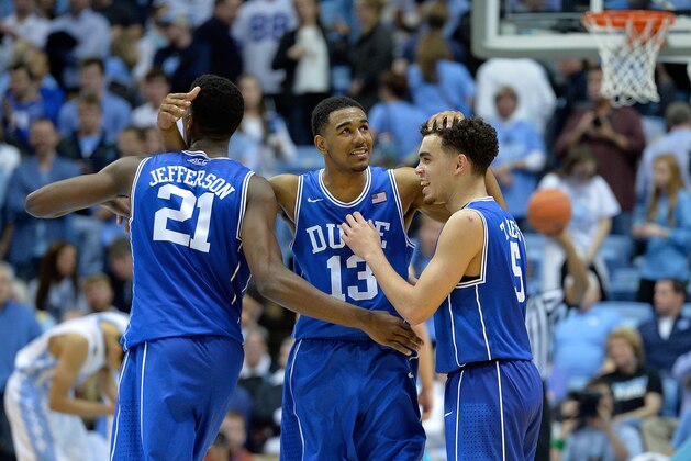 CHAPEL HILL, NC - MARCH 07:  Amile Jefferson #21, Matt Jones #13 and Tyus Jones #5 of the Duke Blue Devils celebrate during the final seconds of a win against the North Carolina Tar Heels at the Dean Smith Center on March 7, 2015 in Chapel Hill, North Carolina. Duke won 84-77.  (Photo by Grant Halverson/Getty Images)