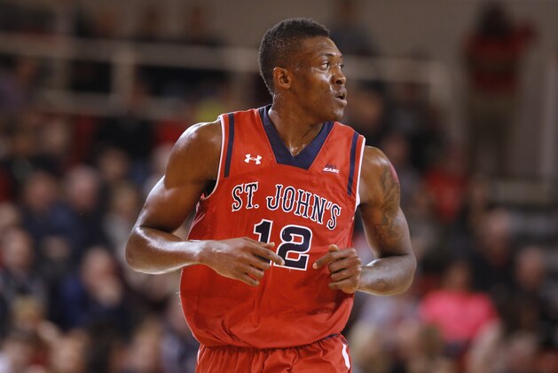St. John's Chris Obekpa (12), of Nigeria, runs the court during the first half of an NCAA college basketball game against Butler Saturday, Jan. 3, 2015, in New York.  Butler beat St. John's 73-69. (AP Photo/Jason DeCrow)