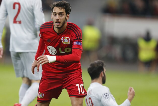 Leverkusen's Hakan Calhanoglu reacts after scoring the opening goal during the Champions League round of 16 first leg soccer match between Bayer 04 Leverkusen and Atletico de Madrid on Wednesday, Feb. 25, 2015 in Leverkusen, Germany. (AP Photo/Frank Augstein)