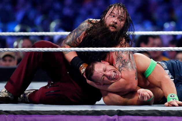John Cena, right, and Bray Wyatt, left, compete during Wrestlemania XXX at the Mercedes-Benz Super Dome in New Orleans on Sunday, April 6, 2014. (Jonathan Bachman/AP Images for WWE)
