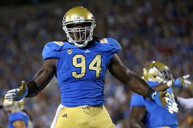 PASADENA, CA - SEPTEMBER 08:   Defensive lineman Owamagbe Odighizuwa #94 of the UCLA Bruins celebrates a UCLA safety against the Nebraska Cornhuskers in the fourth quarter at the Rose Bowl on September 8, 2012 in Pasadena, California.  UCLA won 36-30.  (Photo by Stephen Dunn/Getty Images)