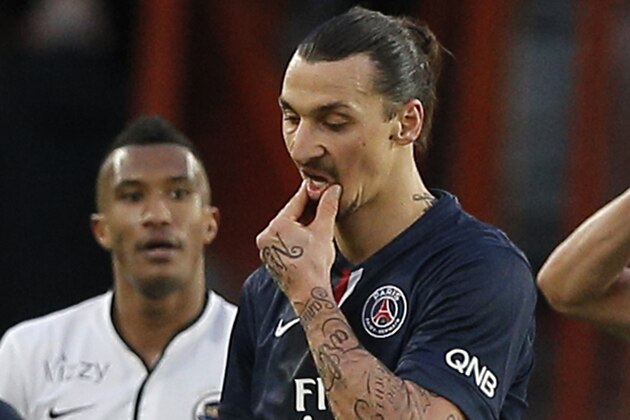 Paris St Germain's Zlatan Ibrahimovic reacts at the end of the French league one soccer match between PSG and Caen, in Paris, France, Saturday, Feb. 14, 2015. The match ended in a draw 2-2.  (AP Photo/Christophe Ena)