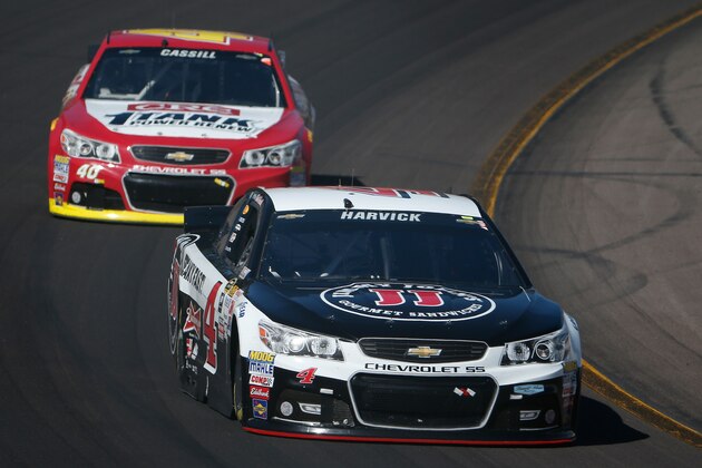 AVONDALE, AZ - MARCH 15:  Kevin Harvick, driver of the #4 Jimmy John's/ Budweiser Chevrolet, leads Landon Cassill, driver of the #40 CRC 1-Tank Renew Chevrolet, during the NASCAR Sprint Cup Series CampingWorld.com 500 at Phoenix International Raceway on March 15, 2015 in Avondale, Arizona.  (Photo by Christian Petersen/Getty Images)