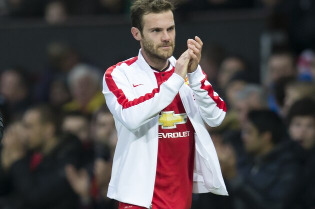 Manchester United's Juan Mata applauds supporters after being substituted during his team's English Premier League soccer match between Manchester United and Tottenham Hotspur at Old Trafford Stadium, Manchester, England, Sunday March 15, 2015. (AP Photo/Jon Super)