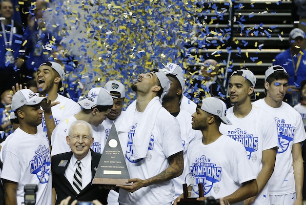 Kentucky forward Willie Cauley-Stein holds the trophy after the NCAA college basketball Southeastern Conference tournament championship game against Arkansas, Sunday, March 15, 2015, in Nashville, Tenn. Kentucky won 78-63. (AP Photo/Steve Helber)