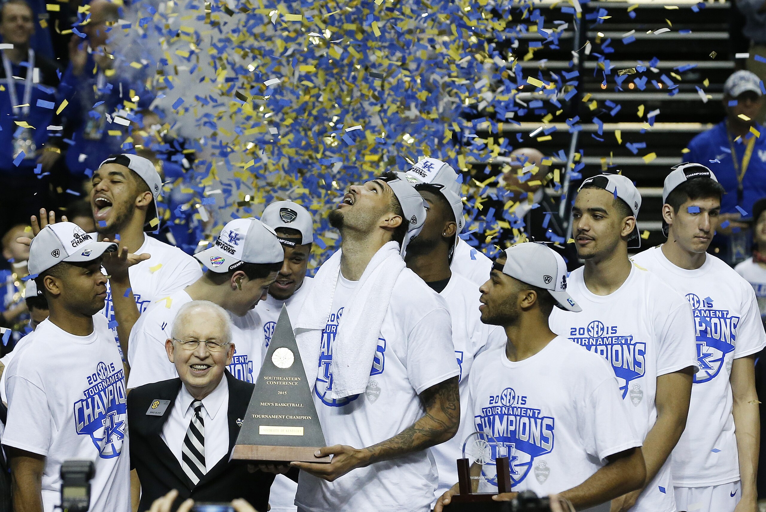 Kentucky forward Willie Cauley-Stein holds the trophy after the NCAA college basketball Southeastern Conference tournament championship game against Arkansas, Sunday, March 15, 2015, in Nashville, Tenn. Kentucky won 78-63. (AP Photo/Steve Helber)