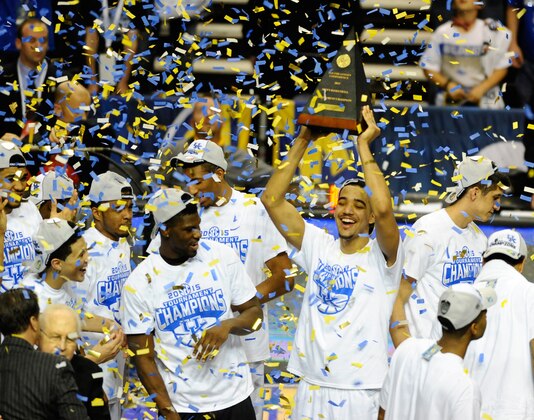 Mar 15, 2015; Nashville, TN, USA; Kentucky Wildcats players celebrate with the championship trophy after winning the SEC Conference Championship game against the Arkansas Razorbacks at Bridgestone Arena. Kentucky won 78-63. Mandatory Credit: Christopher Hanewinckel-USA TODAY Sports