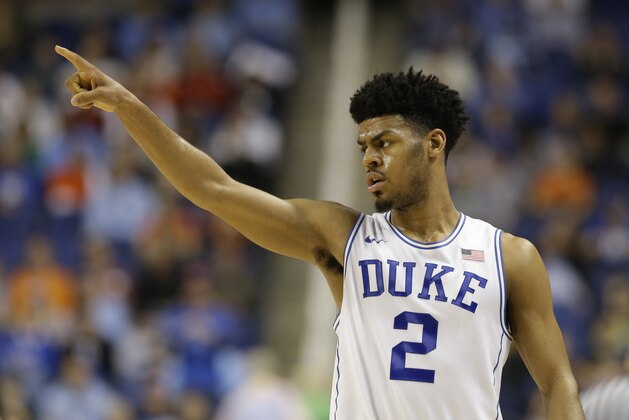 Duke's Quinn Cook (2) reacts during the second half of an NCAA college basketball game against Notre Dame  in the semifinals of the Atlantic Coast Conference tournament in Greensboro, N.C., Friday, March 13, 2015. (AP Photo/Gerry Broome)