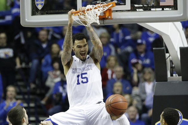 Kentucky forward Willie Cauley-Stein (15) dunks the ball as Auburn forward Alex Thompson (20) and Auburn guard Devin Waddell look on during the second half of an NCAA college basketball game in the semifinal round of the Southeastern Conference tournament, Saturday, March 14, 2015, in Nashville, Tenn. (AP Photo/Mark Humphrey)