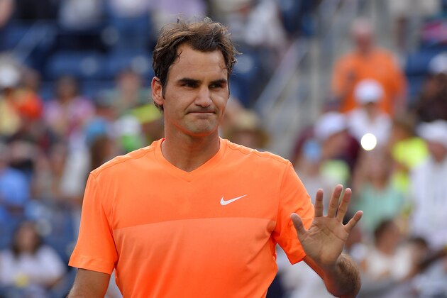 Roger Federer, of Switzerland, waves after defeating Diego Schwartzman, of Argentina, in their match at the BNP Paribas Open tennis tournament, Sunday, March 15, 2015, in Indian Wells, Calif. (AP Photo/Mark J. Terrill)