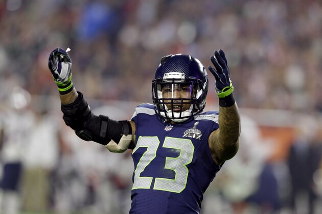 Seattle Seahawks strong safety Jeron Johnson (23) reacts against the New England Patriots during the second half of NFL Super Bowl XLIX football game Sunday, Feb. 1, 2015, in Glendale, Ariz. (AP Photo/Michael Conroy)