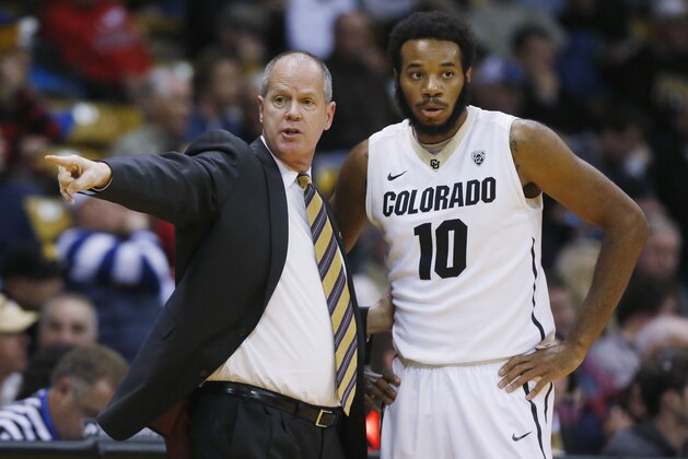 Colorado coach Tad Boyle, left, talks to forward Tre'Shaun Fletcher during a timeout against Arizona during the first half of an NCAA college basketball game Thursday, Feb. 26, 2015, in Boulder, Colo. (AP Photo/David Zalubowski)
