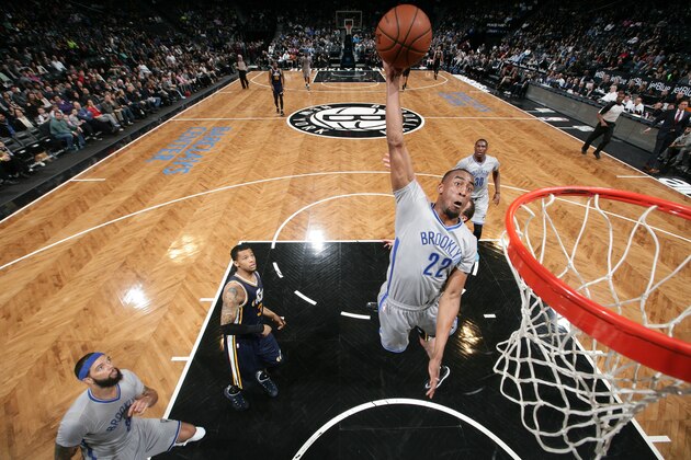 BROOKLYN, NY - MARCH 8: Markel Brown #22 of the Brooklyn Nets dunks against the Utah Jazz during the game on March 8, 2015 at Barclays Center in Brooklyn, New York. NOTE TO USER: User expressly acknowledges and agrees that, by downloading and/or using this photograph, User is consenting to the terms and conditions of the Getty Images License Agreement. Mandatory Copyright Notice: Copyright 2015 NBAE (Photo by Nathaniel Butler/NBAE via Getty Images)