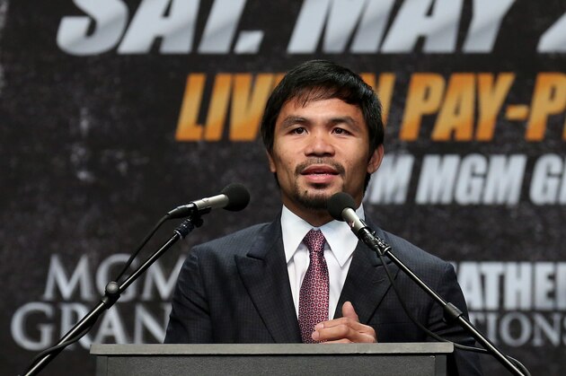 LOS ANGELES, CA - MARCH 11: Manny Pacquiao speaks at the  Floyd Mayweather v Manny Pacquiao  Press Conference on March 11, 2015 in Los Angeles, California.  (Photo by Stephen Dunn/Getty Images)