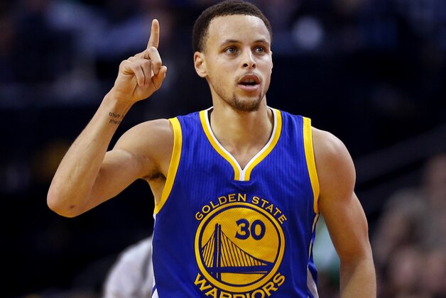 Golden State Warriors guard Stephen Curry heads down the court after making a three point shot during the second half of the Golden State Warriors 106-101 win over the Boston Celtics in an NBA basketball game in Boston, Sunday, March 1, 2015. (AP Photo/Winslow Townson)