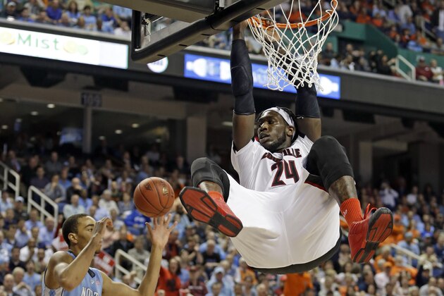 Louisville's Montrezl Harrell (24) dunks against North Carolina's Brice Johnson (11) during the second half of an NCAA college basketball game in the quarterfinals of the Atlantic Coast Conference tournament in Greensboro, N.C., Thursday, March 12, 2015. (AP Photo/Bob Leverone)
