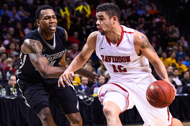 NEW YORK, NY - MARCH 14: Jack Gibbs #12 of the Davidson Wildcats attempts to drive past Treveon Graham #21 of the Virginia Commonwealth Rams during a semifinal game in the 2015 Men's Atlantic 10 Basketball Tournament at the Barclays Center on March 14, 2015 in the Brooklyn borough of New York City.  (Photo by Alex Goodlett/Getty Images)